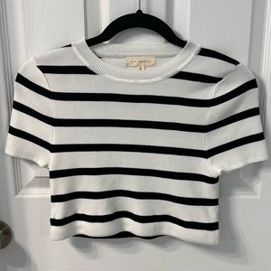 Never worn, trendy black and white crop top. Size small